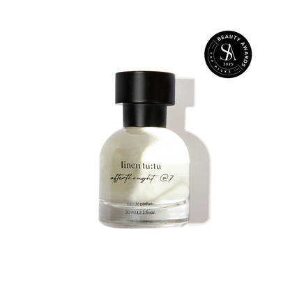 Perfume bottle labeled &quot;linen tutu afterthought @7&quot; with a black cap on a white background, featuring a Skin Anarchy Top Picks 2025 award badge.
